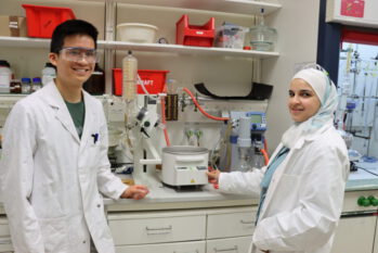 Ruba Ajjour and Huy Bui Duc working in the lab